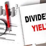 DIVIDEND YIELD text written on a notebook with chart